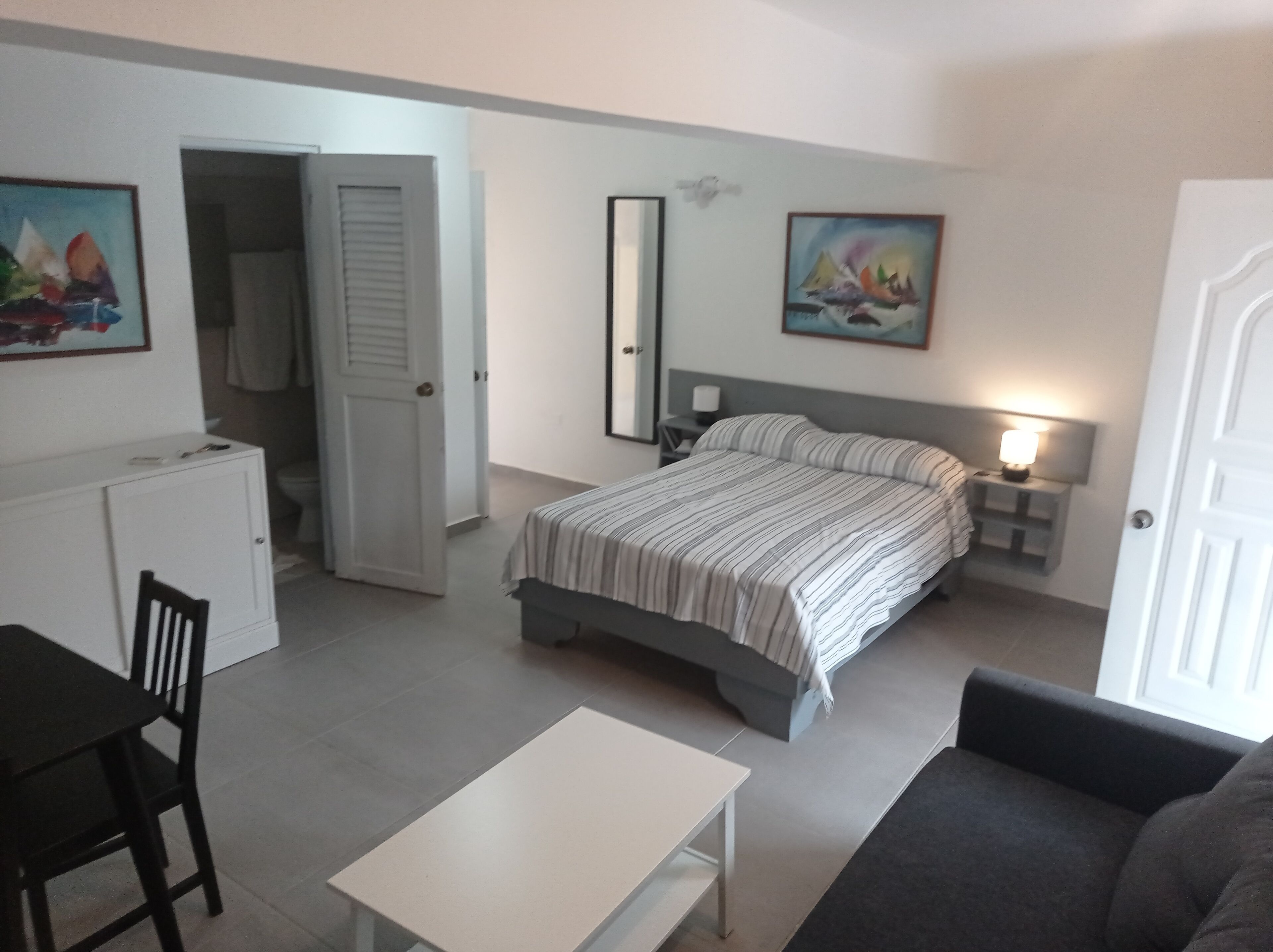 classic double room, multiple beds, balcony, pool view | in-room safe, desk, laptop workspace, blackout curtains