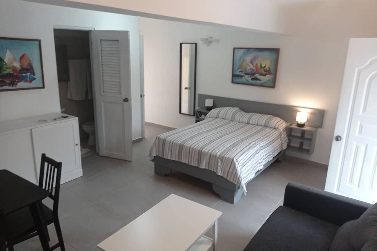 classic double room, multiple beds, balcony, pool view | in-room safe, desk, laptop workspace, blackout curtains