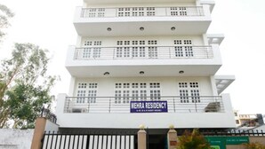 A multi-story building with a sign reading "MEHRA RESIDENCY". - Mehra Residency at the Airport (New Delhi)