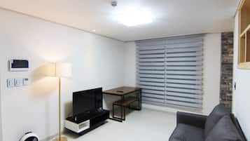 Family House, 3 Bedrooms | Living area | Flat-screen TV