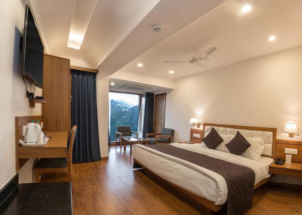 Premium bedding, desk, laptop workspace, blackout curtains