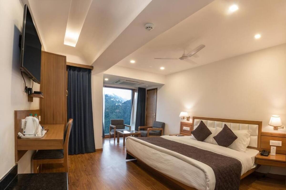 Premium bedding, desk, laptop workspace, blackout curtains
