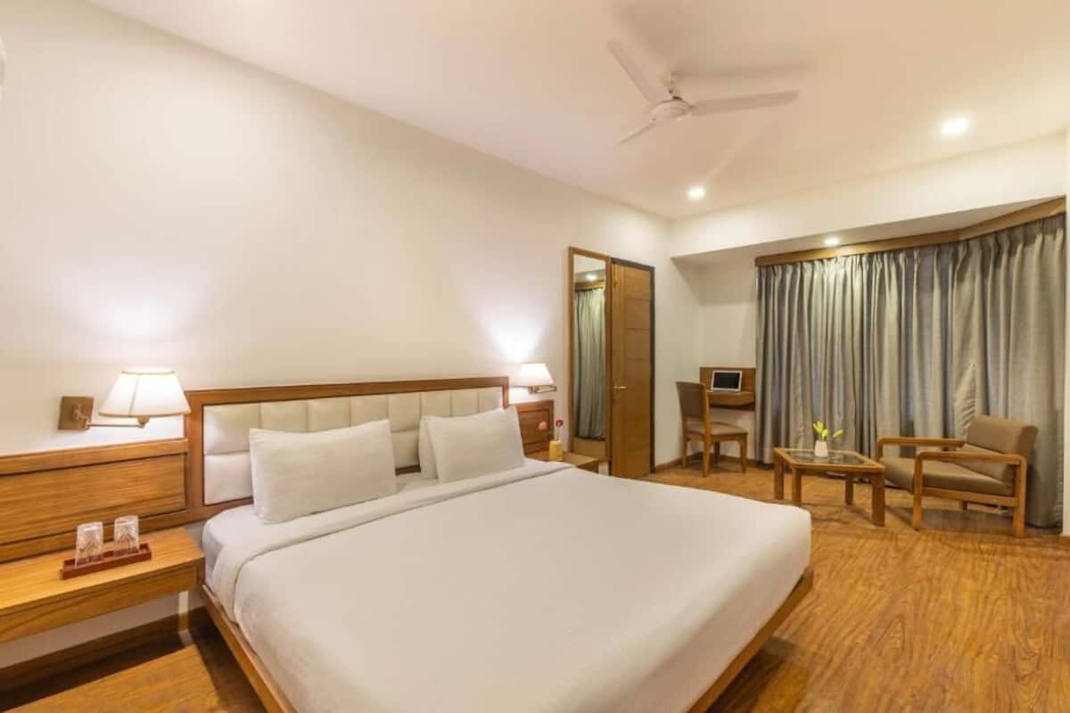 Premium bedding, desk, laptop workspace, blackout curtains