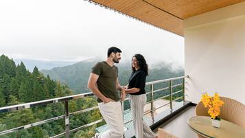 Premium bedding, desk, laptop workspace, blackout drapes