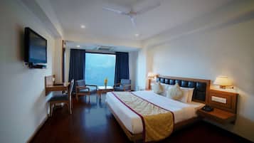 Premium bedding, desk, laptop workspace, blackout curtains
