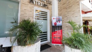 A hotel entrance with a sign reading "HOTEL AND SPA ENTRANCE". - RedDoorz near Bambang Station (Manila)