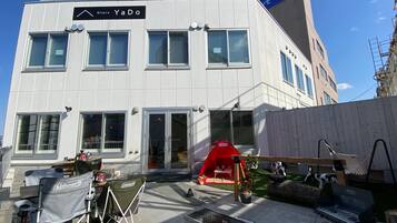 A modern building with a sign reading "Otaru YaDo".