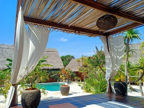 Deluxe Cottage, 1 Queen Bed, Pool View, Garden Area | View from room - Loedi Bungalows Rote (Rote Island)