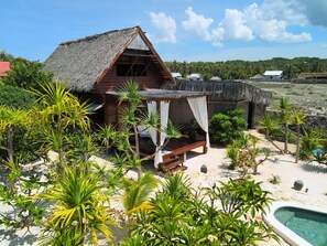 Deluxe Cottage, 1 Queen Bed, Pool View, Garden Area | 1 bedroom, premium bedding, in-room safe, desk - Loedi Bungalows Rote (Rote Island)