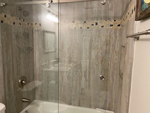 Combined shower/tub, hair dryer, towels, soap