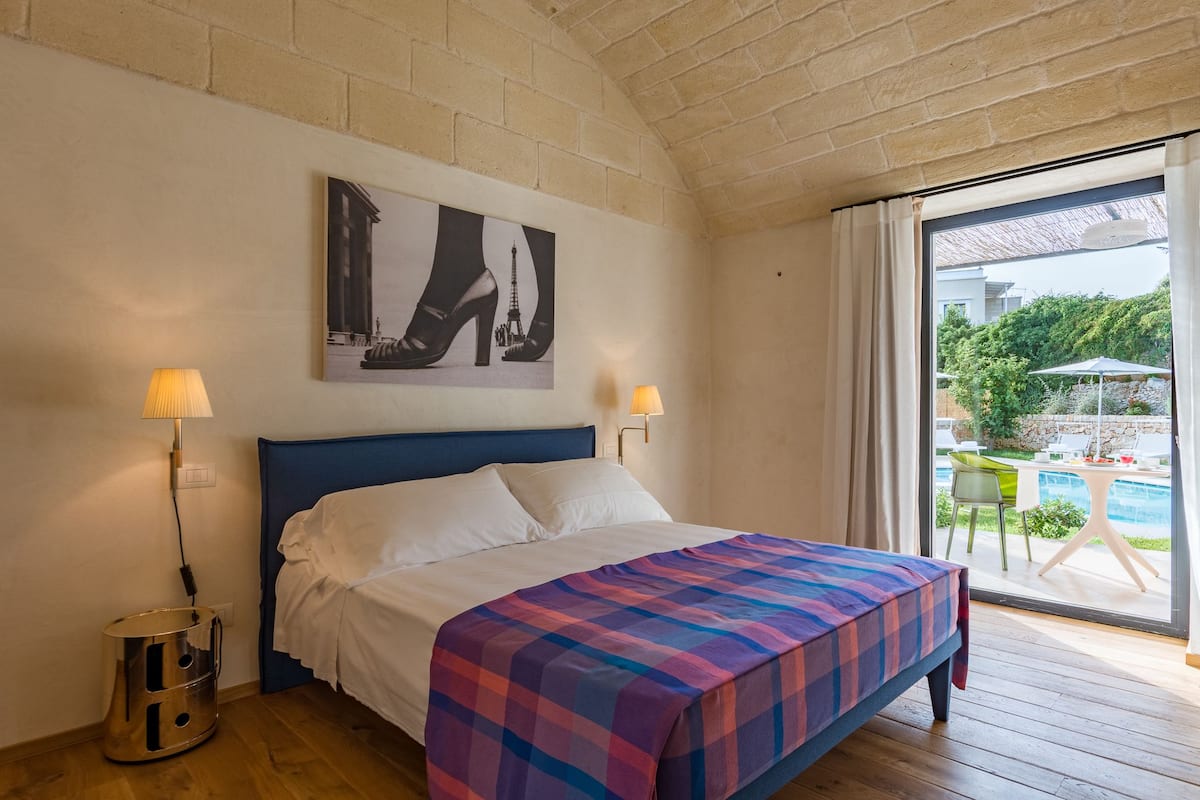 Deluxe Room, 1 Queen Bed, Non Smoking, Pool View | Premium bedding, down duvets, memory-foam beds, desk