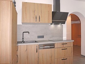Enjoy cooking in this well-lit kitchen with a dishwasher, stainless steel sink, and sleek cabinetry.