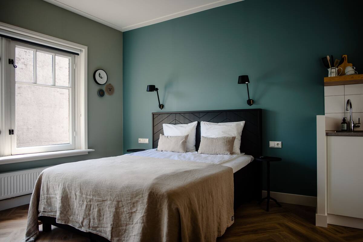 Room, Kitchenette | In-room safe, iron/ironing board, free WiFi, bed sheets