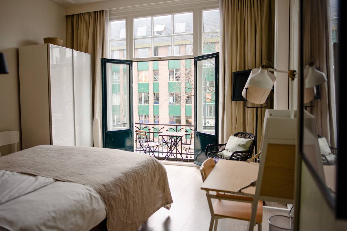 Deluxe Double Room, Balcony | In-room safe, iron/ironing board, free WiFi, bed sheets