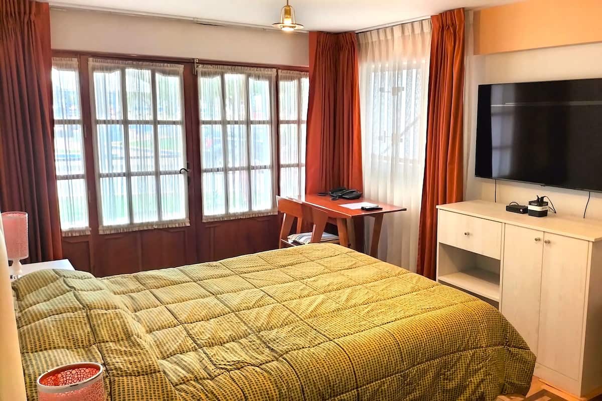 Select Comfort beds, desk, laptop workspace, iron/ironing board
