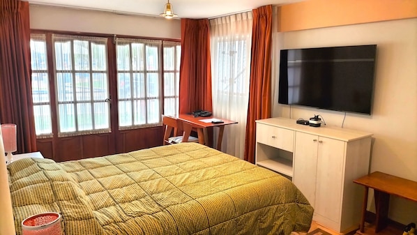 Select Comfort beds, desk, laptop workspace, iron/ironing board