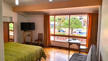 Select Comfort beds, desk, laptop workspace, iron/ironing board