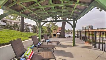 Relax in a tranquil outdoor seating area with lounge chairs and comfortable cushions.
