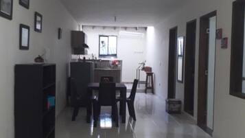 Family Apartment, Multiple Beds | Living room | Flat-screen TV