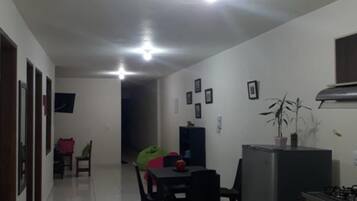 Family Apartment, Multiple Beds | Living room | Flat-screen TV