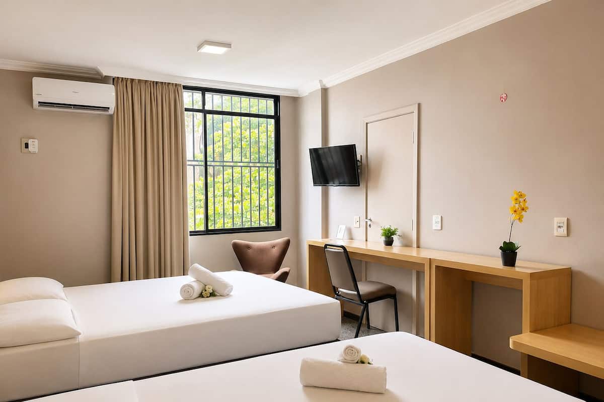 Deluxe Triple Room | Minibar, in-room safe, desk, laptop workspace