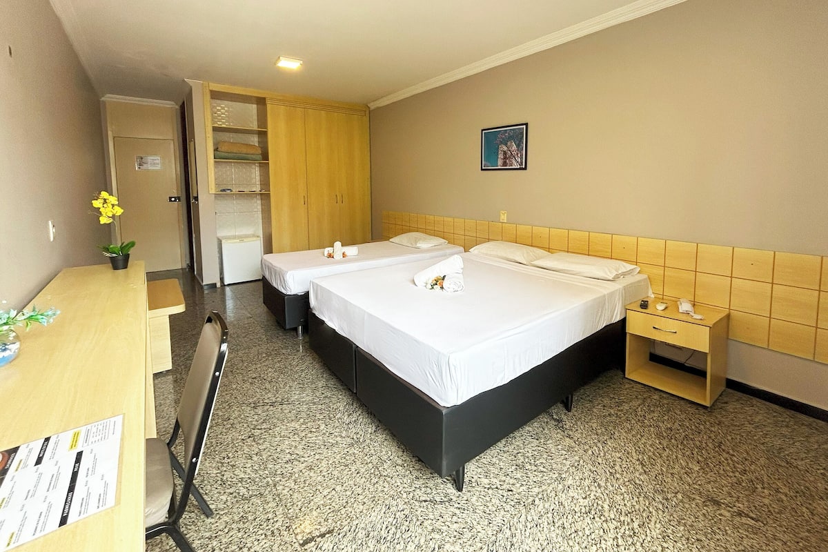 Deluxe Triple Room | Minibar, in-room safe, desk, laptop workspace