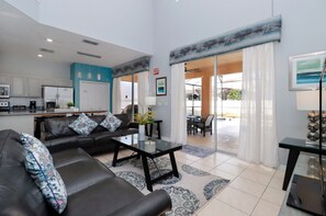 Una televisión, una consola de videojuegos, un futbolín