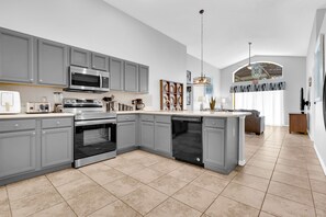 Family House | Private kitchen | Fridge, coffee/tea maker, electric kettle, highchair