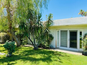 Enjoy a serene atmosphere surrounded by mature trees and a well-maintained lawn.