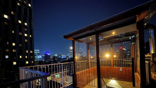 A night view from a balcony with a cityscape in the background. - The Phase Boutique Hotel (Seoul)