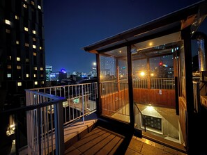 A night view from a balcony with a cityscape in the background. - The Phase Boutique Hotel (Seoul)