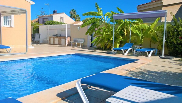 Outdoor pool, a heated pool, pool loungers