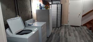 Convenient laundry facilities with a front-loading washer and dryer.