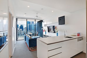 1 Bedroom Apartment City View | Living area | 50-inch flat-screen TV with digital channels, TV
