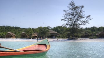 On the beach, white sand, sun loungers