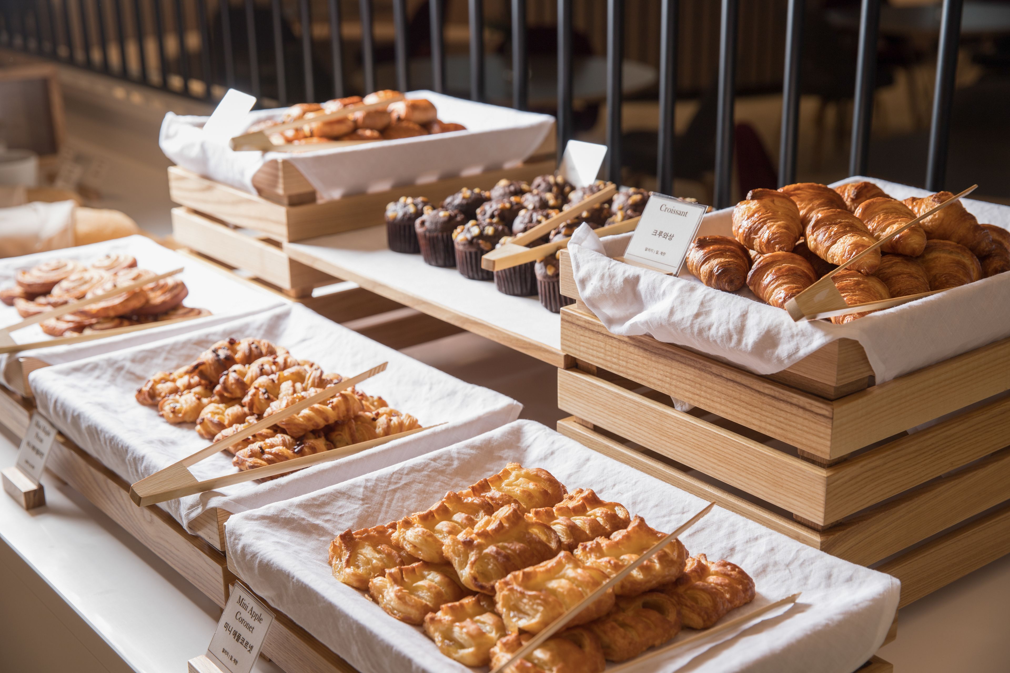 A bakery display with various pastries and baked goods.