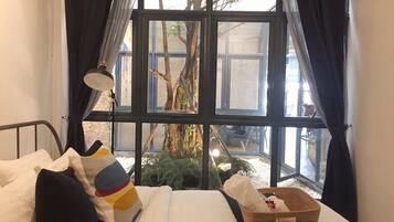 Basic Double Bed with Shared Bathroom | Blackout drapes, free WiFi, bed sheets