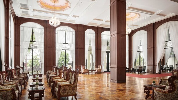 A grand hall with ornate wooden furniture, large windows, and a chandelier. - Le Castle River Hotel & Apartment (Phnom Penh)