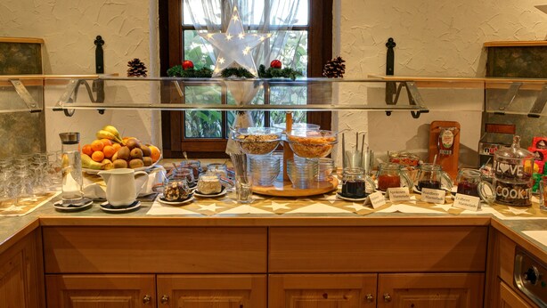 A breakfast buffet with various food items and condiments. - Hotel Bruker (Grossbottwar)