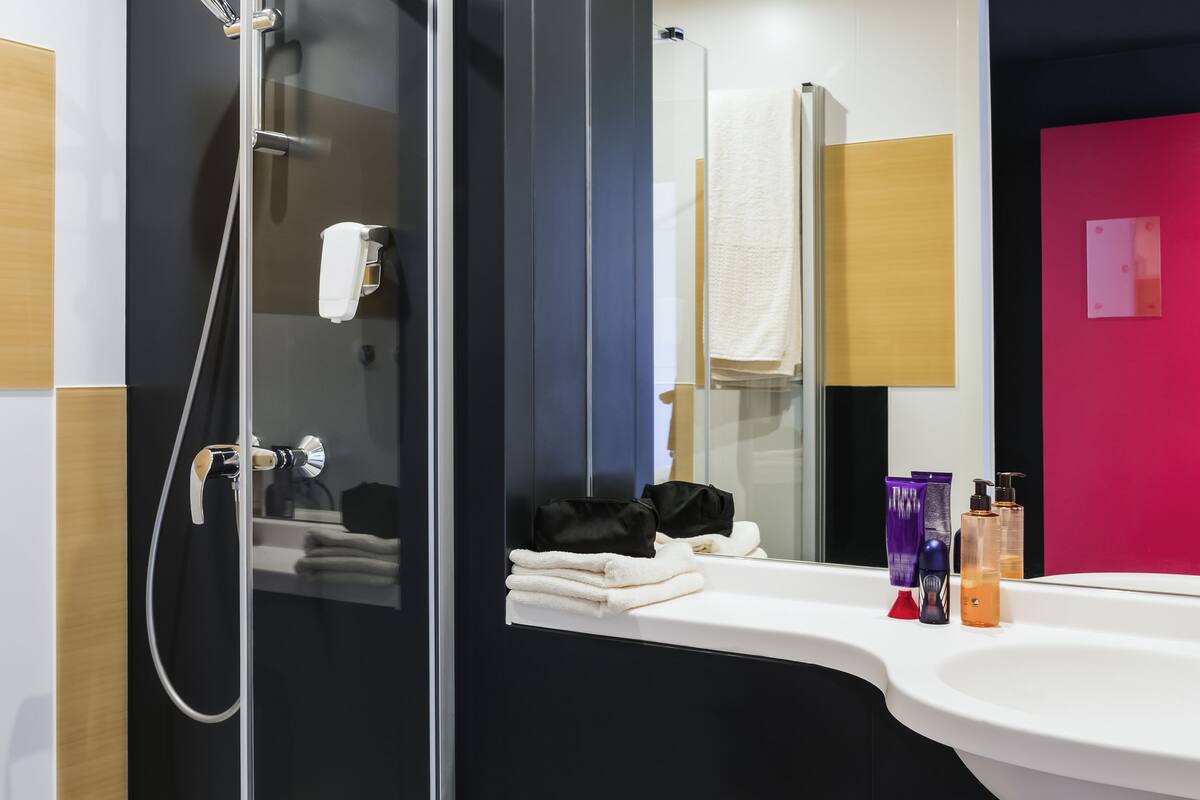 shower, eco-friendly toiletries, hair dryer, towels