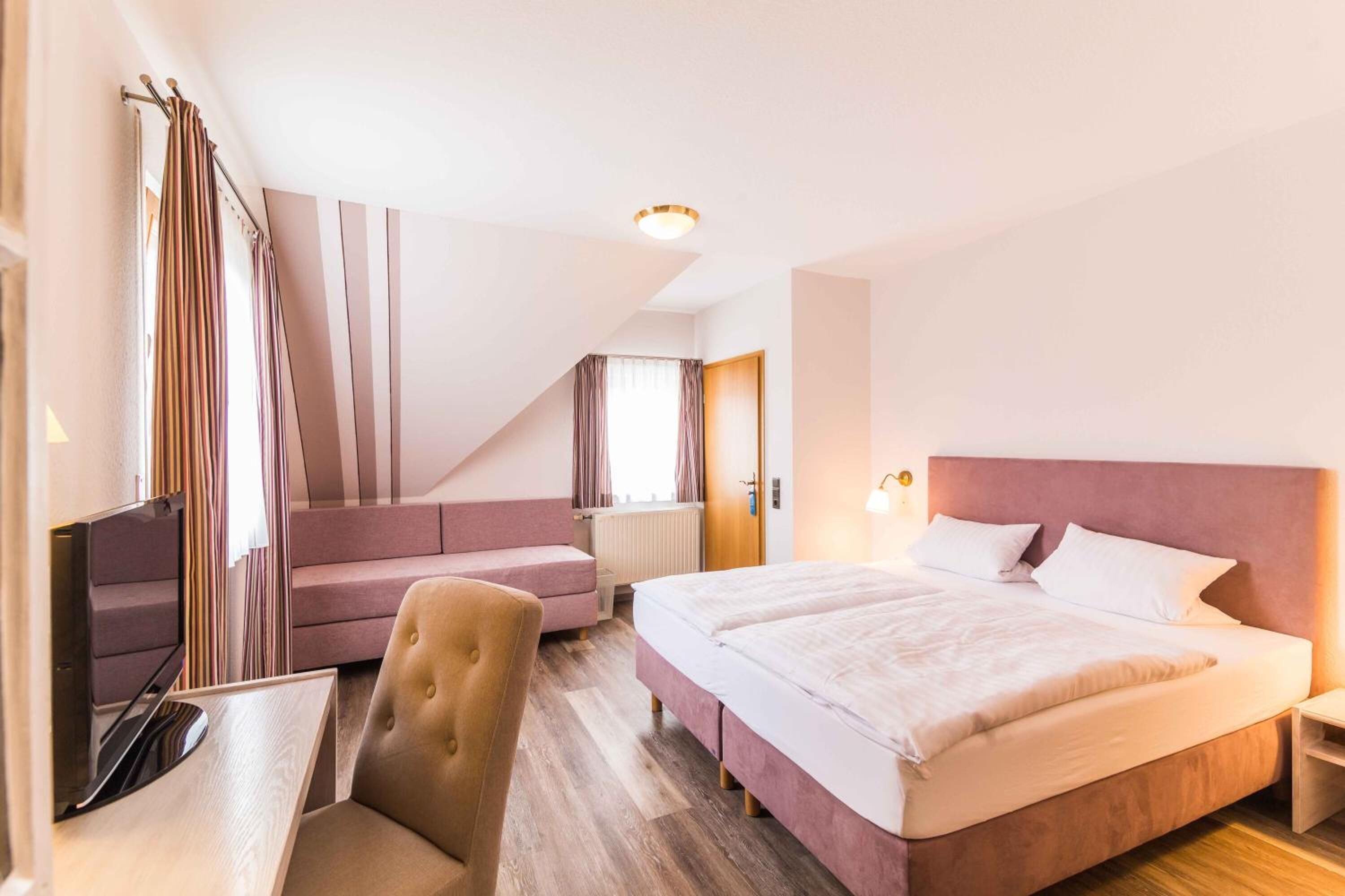 desk, laptop workspace, blackout curtains, cots/infant beds