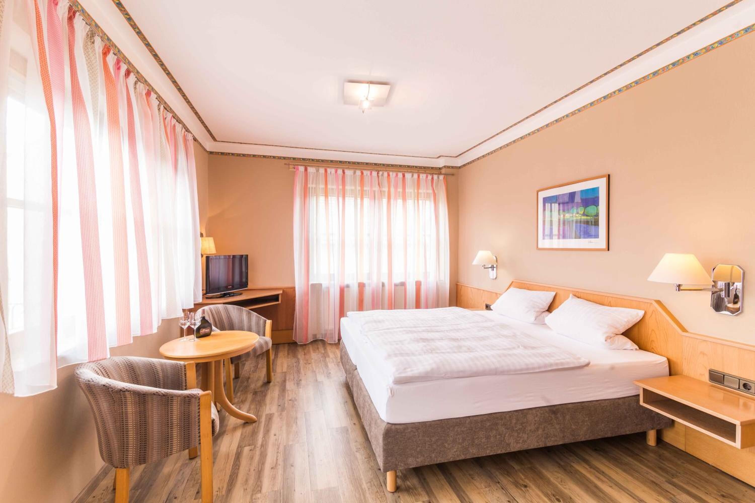 desk, laptop workspace, blackout curtains, cots/infant beds