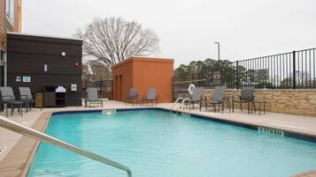 Outdoor pool, open 6:00 AM to 11 PM, pool umbrellas, sun loungers