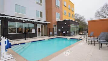 Outdoor pool, open 6:00 AM to 11 PM, pool umbrellas, pool loungers