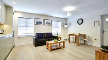 Apartment, 1 Bedroom | Living area | Flat-screen TV