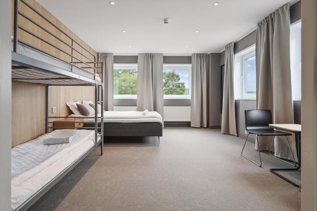 Basic Quadruple Room, Multiple Beds, Shared Bathroom | Blackout drapes, soundproofing, WiFi (free), bed sheets