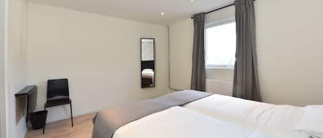 Blackout curtains, soundproofing, free WiFi, bed sheets