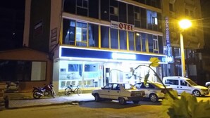 A multi-story building with a prominent sign for a hotel. - Otel Alimoglu (Gelendost)
