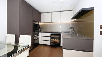 Family Apartment, 2 Bedrooms, Garden View | Living area | Flat-screen TV, heated floors