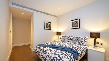 Family Apartment, 2 Bedrooms, Garden View | Laptop workspace, iron/ironing board, bed sheets